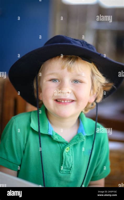 Blonde Preschool Boy Smiling And Posing For Kindy Portraits Stock Photo