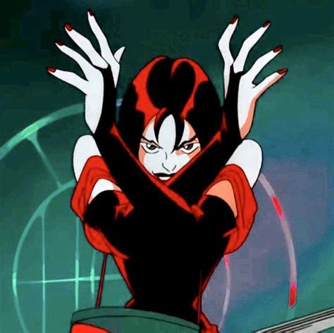 An Animated Image Of A Woman With Red Hair And Black Makeup Holding Her