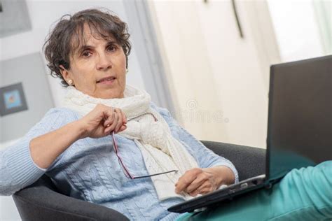 Portrait Of Beautiful Brunette Mature Woman Using Laptop Stock Image