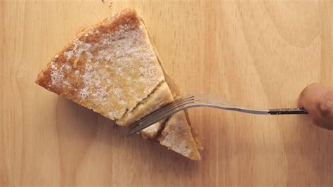 Top Down View Of A Fork Cutting Into A Slice Of Apple Pie 14046673
