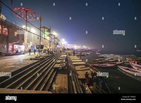 Varanasi Ganges River Ghat At Night With Ancient Architecture And