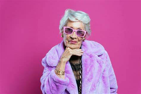 Premium Photo Portrait Of Woman Wearing Sunglasses While Standing Against Yellow Background