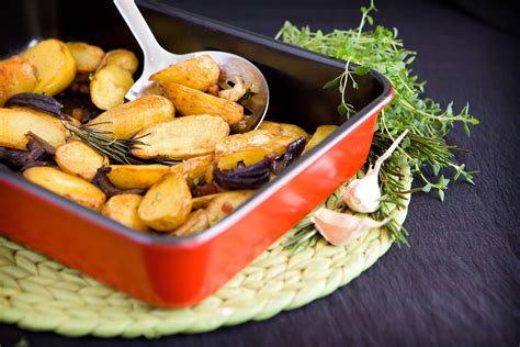 Herby roast potatoes recipe - Seasonal Spuds