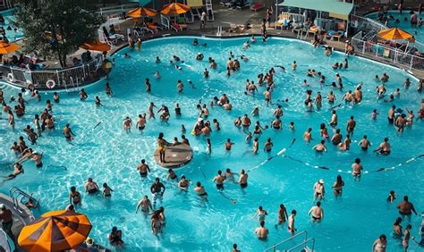 Crowded Public Pool People Swimming Premium Ai Generated Image