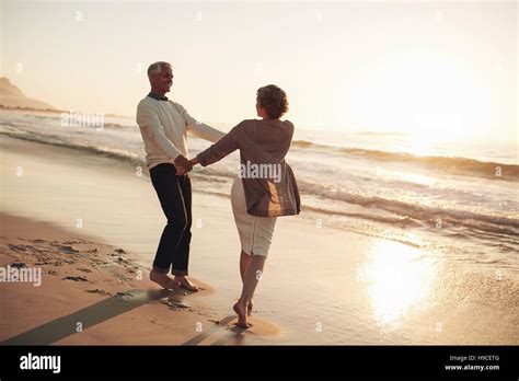 Romantic Mature Couple Enjoying A Day At The Beach Mature Couple