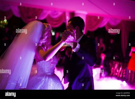 Amazing First Wedding Dance Of Newlyweds On Low Pink Light And Heavy