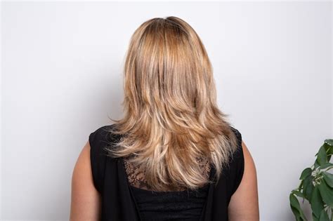 Premium Photo Rear View Of A Woman With Long Wavy Blonde Hair Wear