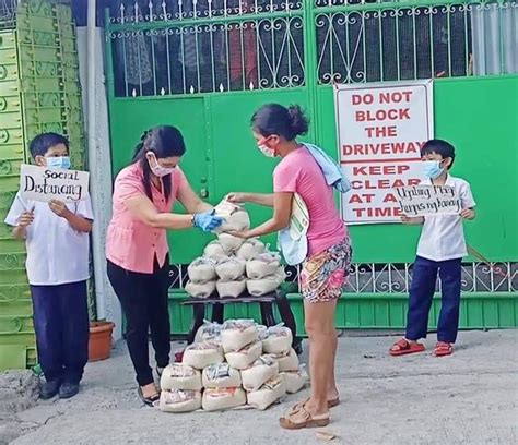 Generous Teacher Earns Praise For Giving Relief Goods To Neighbors