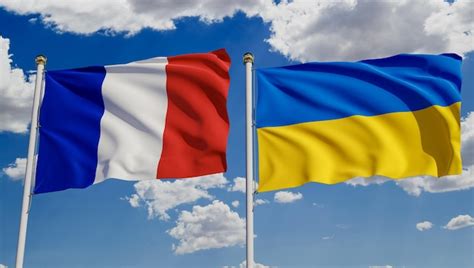 Premium Photo French And Ukrainian Flags Over Blue Sky Concept Of