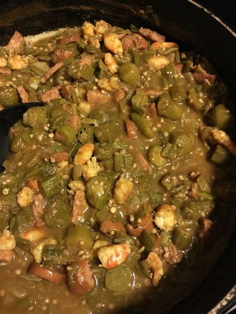 A Pot Filled With Green Beans And Meat