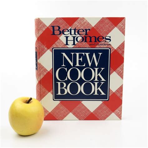 The New Cook Book Is Next To An Apple