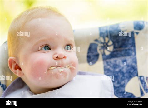 Messy baby eating, portrait Stock Photo - Alamy