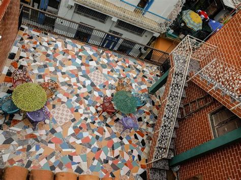 Premium Photo High Angle View Of Empty Chairs And Tables In Courtyard
