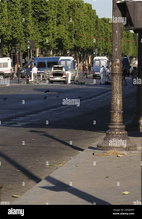 Police Officers Patrol Near The Champs Elysees Avenue On June