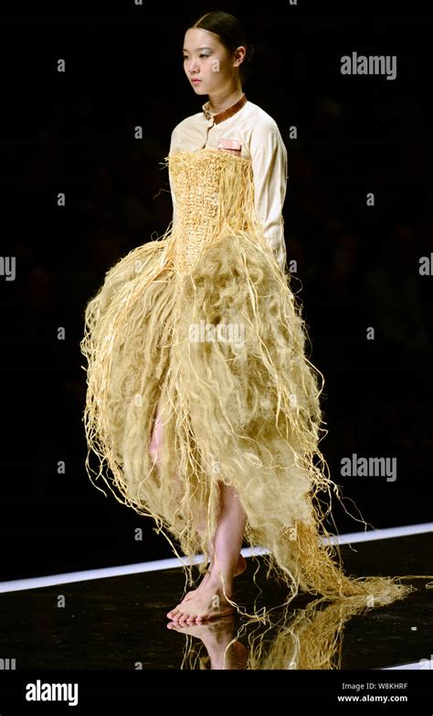 A model displays a new creation at Hempel Award - The 24th China ...