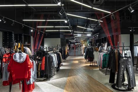 Modern Clothes Shop with Large Selection of Different Wear and Shoes ...