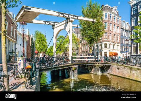 Amsterdam May 7 2018 Tourist Crossing The Groenburgwal Over The