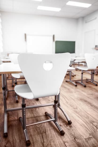 Premium Photo Chair And Desk In Empty Classroom Closeup