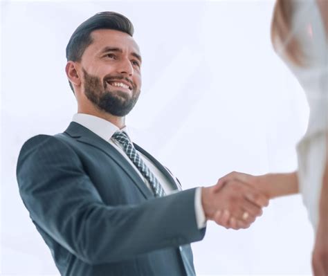 Premium Photo Two Business Workers Shake Hands In Office