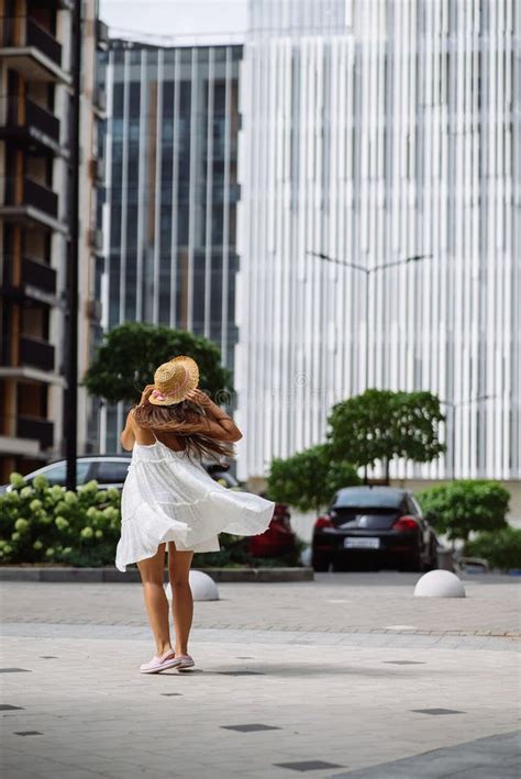 Beautiful Pretty Woman In White Dress Walking At City Street Stock