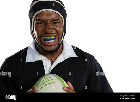 Portrait Of Male Rugby Player Wearing Mouthguard White Holding Rugby