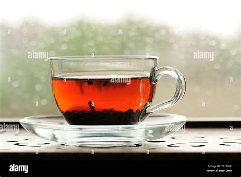 Shu Puerh Tea Brewed In Glass Cup On Window Sill Horizontal Stock Photo