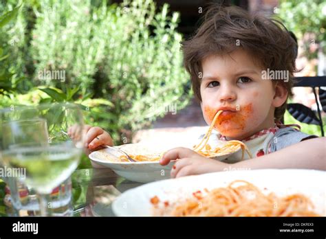 Portrait Messy Boy Eating Spaghetti Hi Res Stock Photography And Images