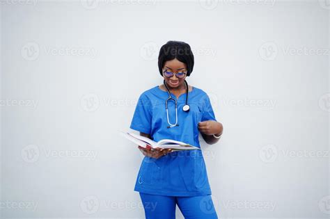 Portrait of happy female african american young doctor pediatrician in ...