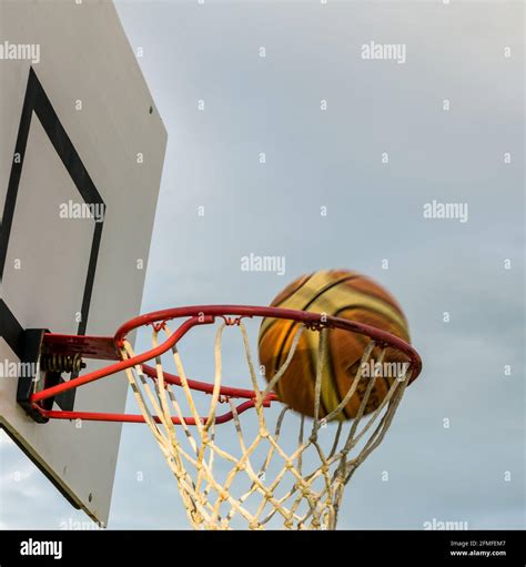 Basketball Going Through Hoop Stock Photo Alamy