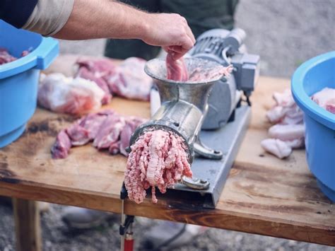 Premium Photo High Angle Of Crop Faceless Male Butcher Putting Fresh