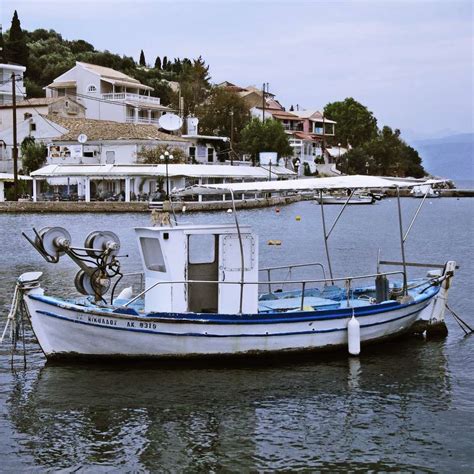 White And Blue Boat On Water During Daytime Sliding Puzzle On