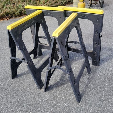 Four Plastic Folding Sawhorses (OBL-DW) | EstateSales.org