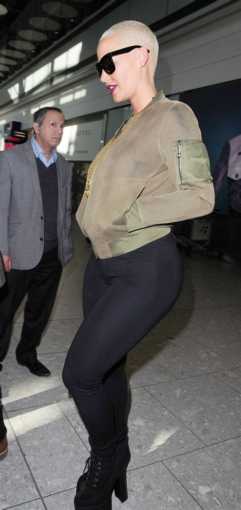 AMBER ROSE at Heathrow Airport in London 04/20/2015 – HawtCelebs