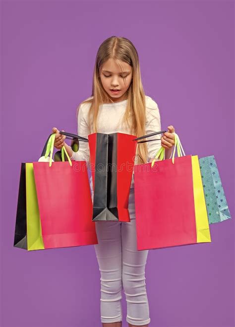 Curious Teen Girl With Shopping Purchase Isolated On Purple Teen Girl With Shopping Purchase