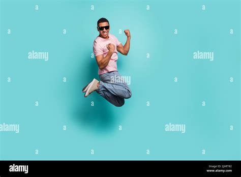 Full Length Photo Of Lucky Excited Man Dressed Pink T Shirt Rising