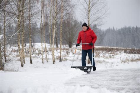 Premium Photo | Full length of man walking on snow covered landscape