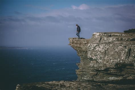 Man Standing On Cliff · Free Stock Photo