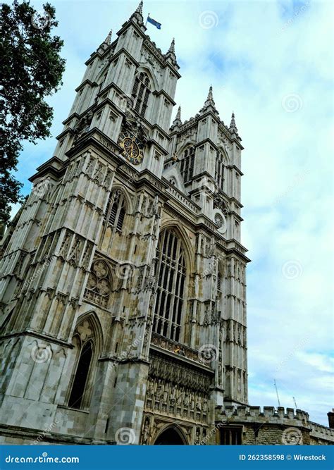 Vertical Low Angle Shot Of The Westminster Abbey With A Blue Sky And