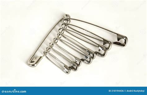 Bunch Of Safety Pins On Light Background Stock Photo Image Of Gold