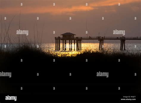 Okaloosa island Pier at sunset Stock Photo - Alamy