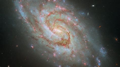 Hubble Space Telescope Spies A Spiral Galaxy In A Cosmic Clock Space