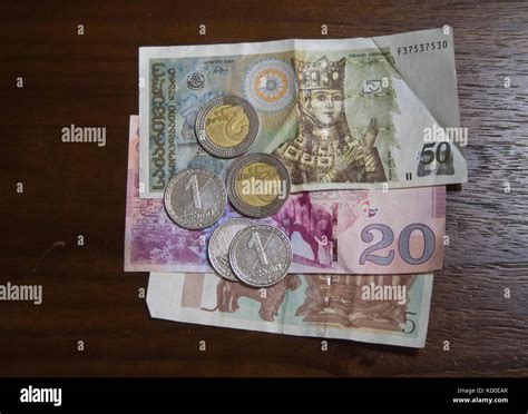 Georgian lari banknotes and coins on tabletop Stock Photo - Alamy