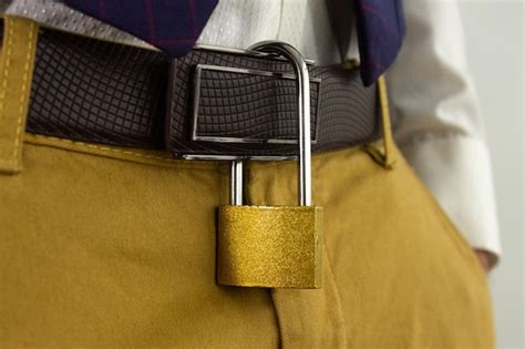 Premium Photo Padlock Hanging From Man S Belt Symbol Of Marital