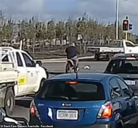 Horrific Moment A Motorbike Rider Sneaks Past Traffic And Runs A Red