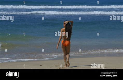 MODEL WALK BEACH ORANGE BIKINI MIDIGAMA SRI LANKA Stock Video Footage