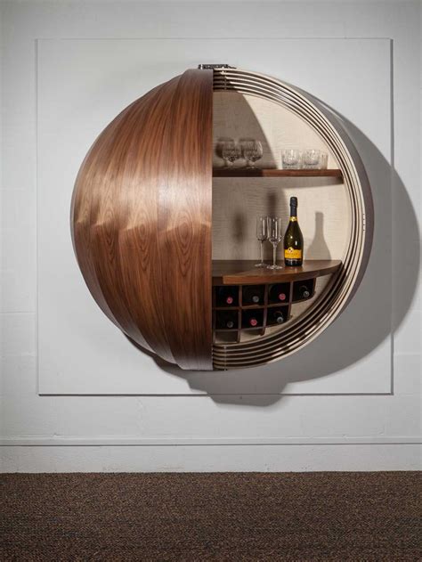 A Wall-Mounted Bar Cabinet Inspired by a Spinning Coin