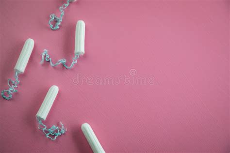 Tampons On Pink Background For Female Personal Hygiene And Protection During Menstruation Period