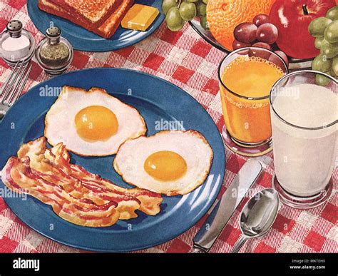 Breakfast with Bacon, Eggs, Toast, Orange Juice and Milk Stock Photo - Alamy