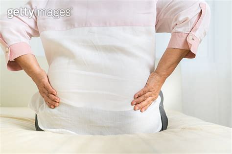 Back Pain Of Old Woman At Home Healthcare Problem Of Senior Concept