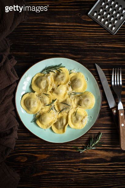 Traditional Italian Ravioli With Rosemary And Parmesan Served On A